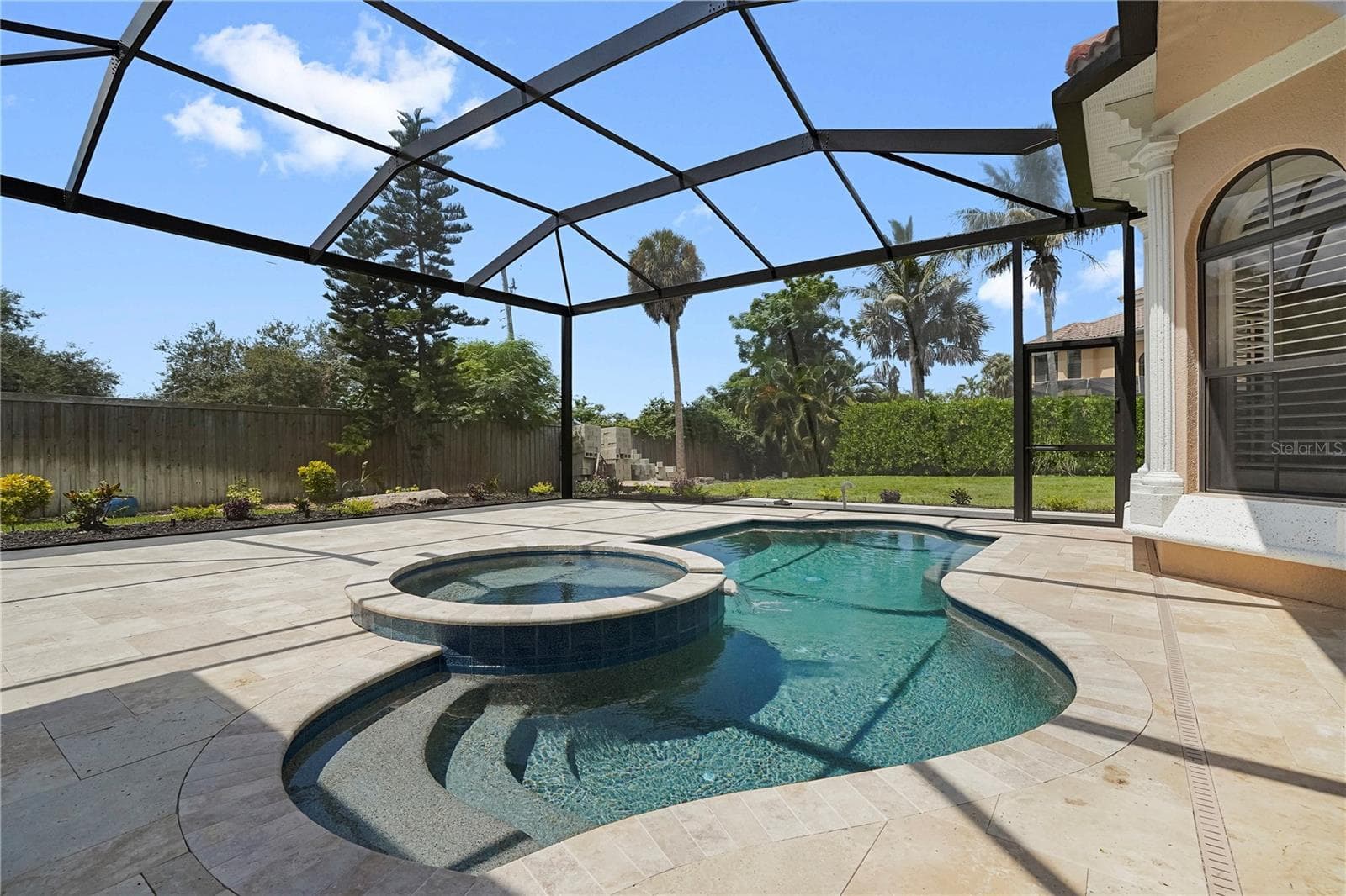 New extended Pool Cage, screening & Travertine Pavers. - 1650 ASSISI DR #16, SARASOTA