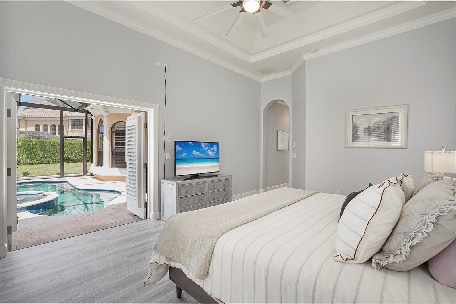 Primary Bedroom with french doors to the pool area - 1650 ASSISI DR #16, SARASOTA