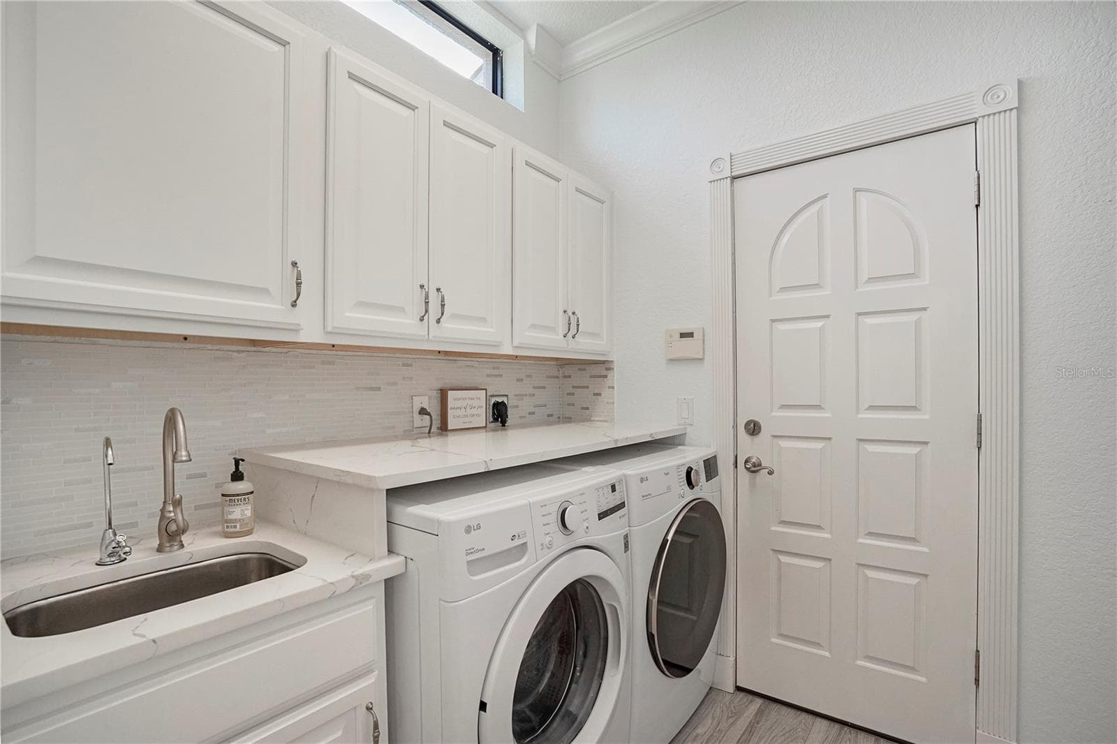 Laundry room with a sink off kitchen - 1650 ASSISI DR #16, SARASOTA