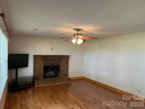 13'7 x 17'3 living room with masonry fireplace, hardwood floors, offset foyer 5'2 x 3'9 - 1211 Sharon School Road, Stony Point