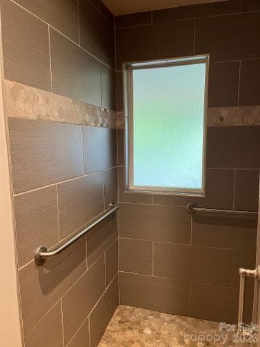 Tiled Shower entrance with grab bars and room for a shower seat - 1211 Sharon School Road, Stony Point