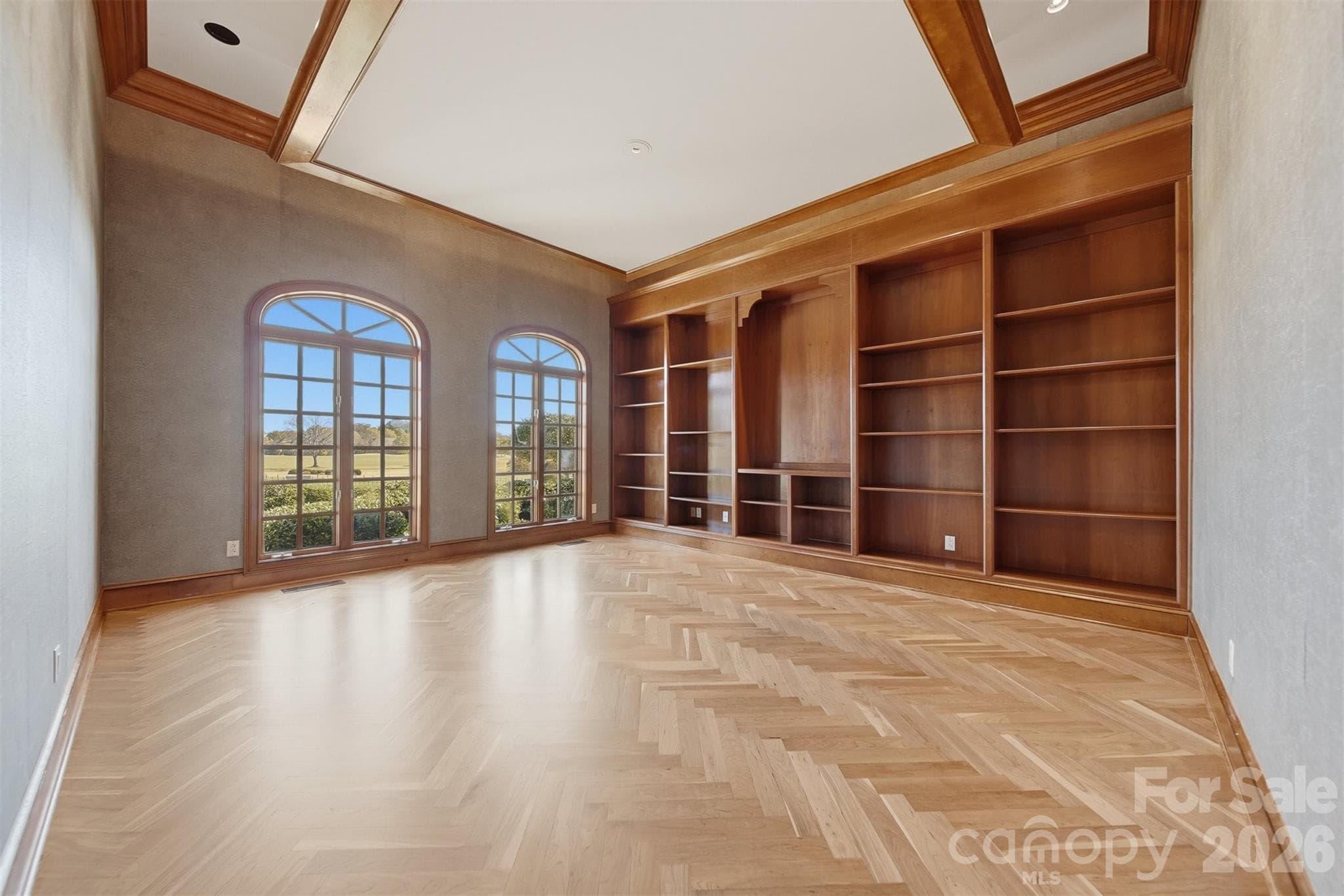 Owner's den with wet bar, fireplace, and custom woodwork perfect for entertaining. - 3619 Links Drive NE, Conover