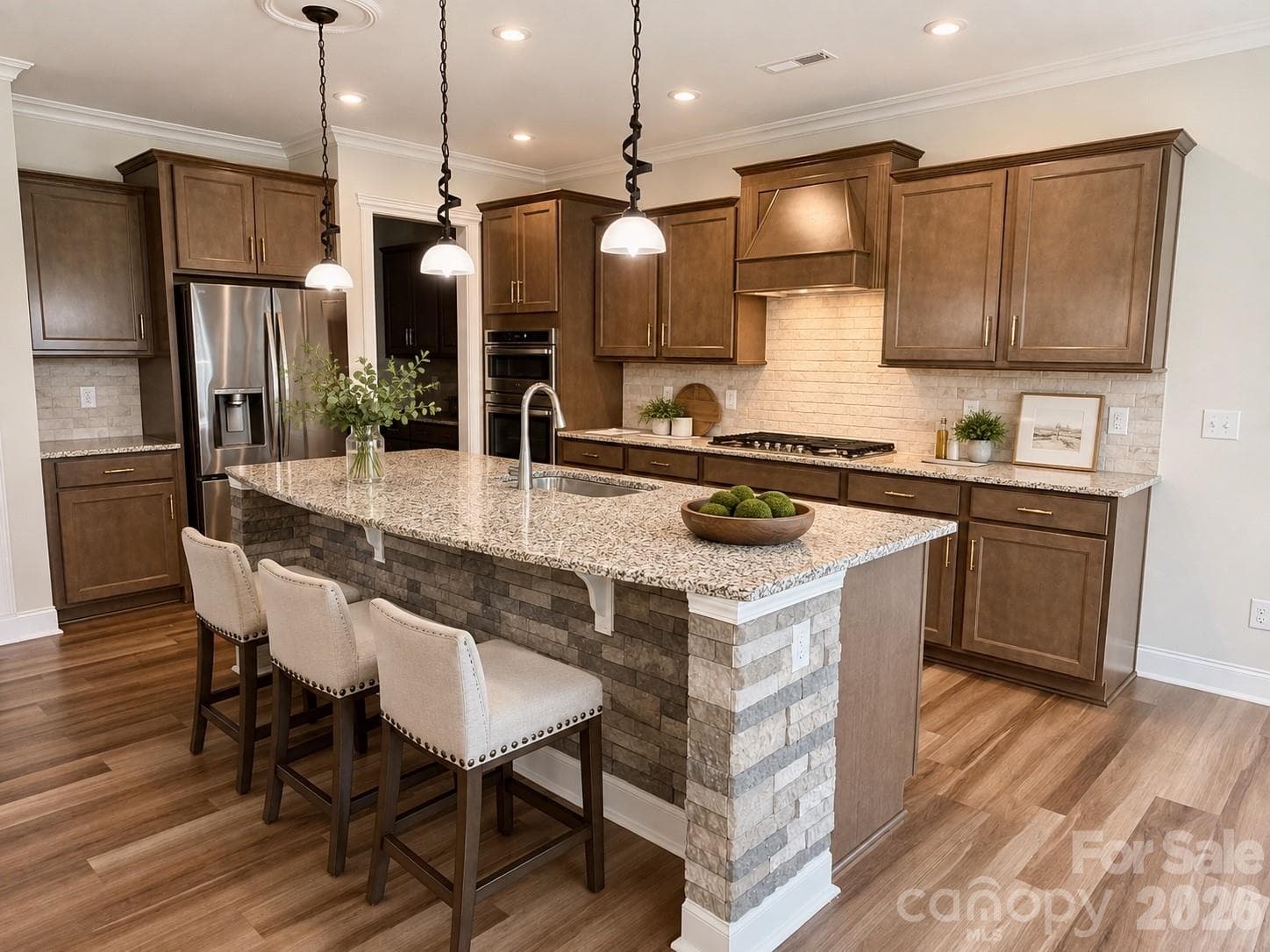 Gourmet Kitchen with large entertaining island, built in gas cooktop, upgraded vent hood, tile backsplash, granite countertops, built in oven and microwave oven.  Butlers Pantry. (virutally staged image) - 1318 Poppy Way, Matthews
