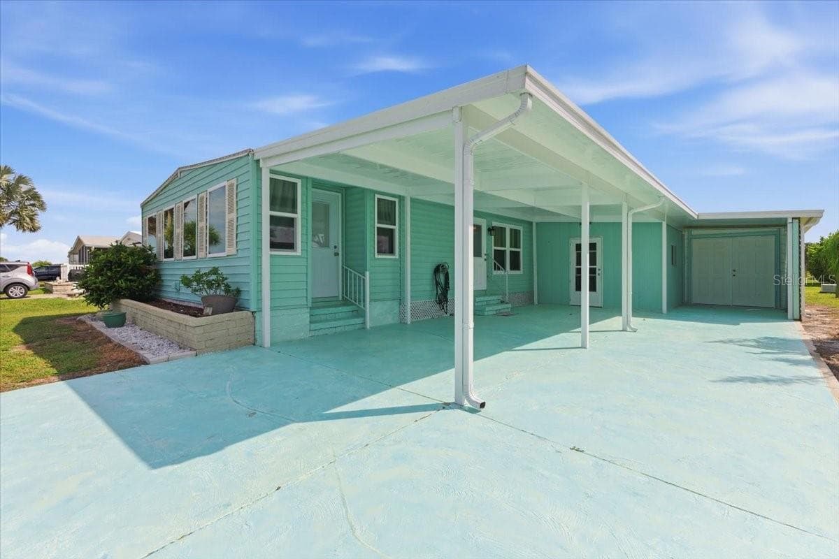Carport offers extra parking - 1451 BLUE HERON DR, ENGLEWOOD