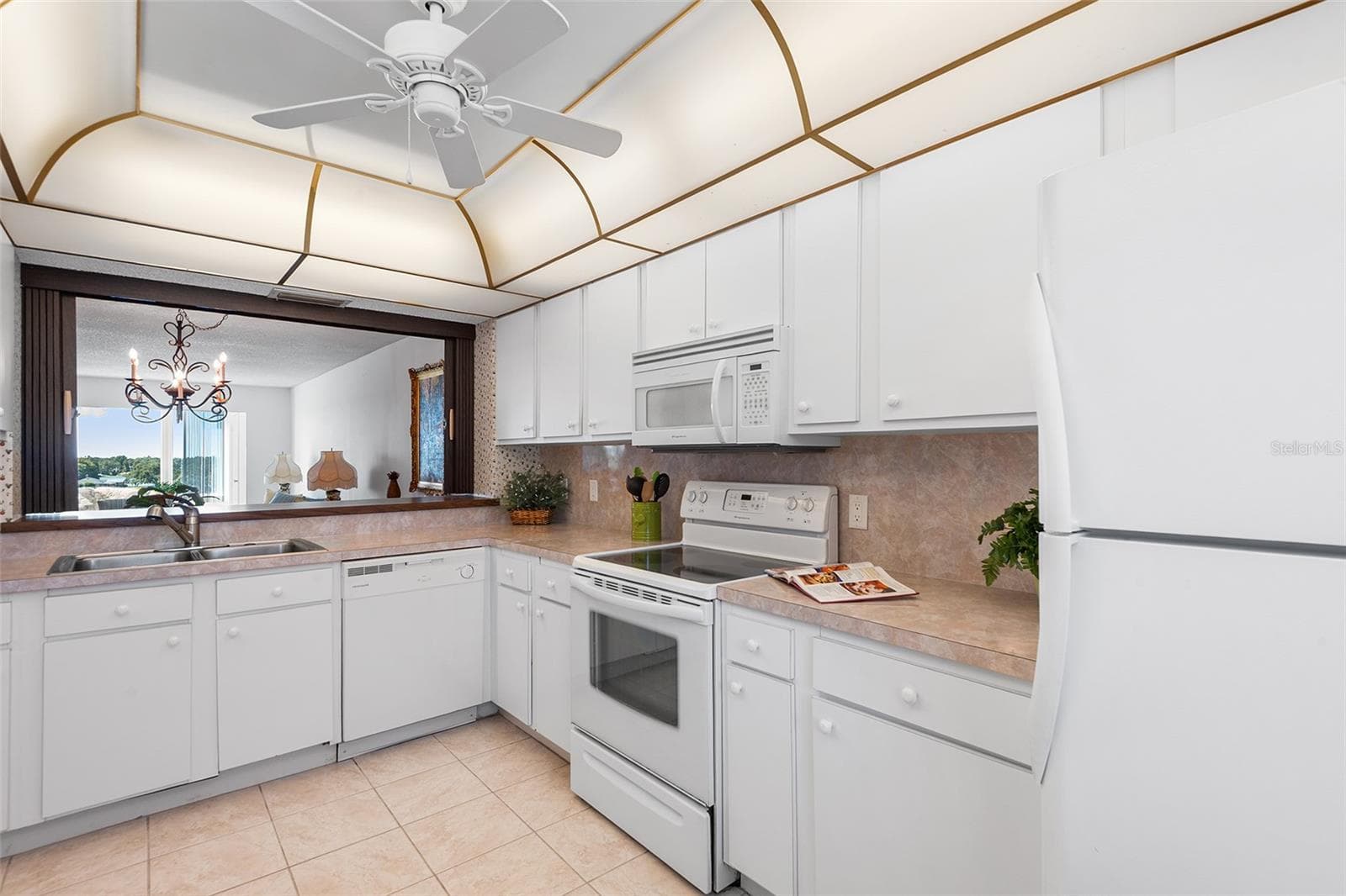 Tile floor and opening to living area - 1776 6TH ST NW #409, WINTER HAVEN