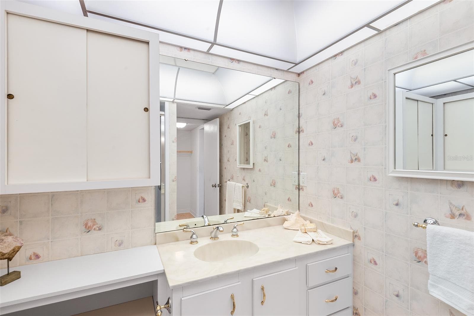 Primary bathroom with plenty of cabinets - 1776 6TH ST NW #409, WINTER HAVEN