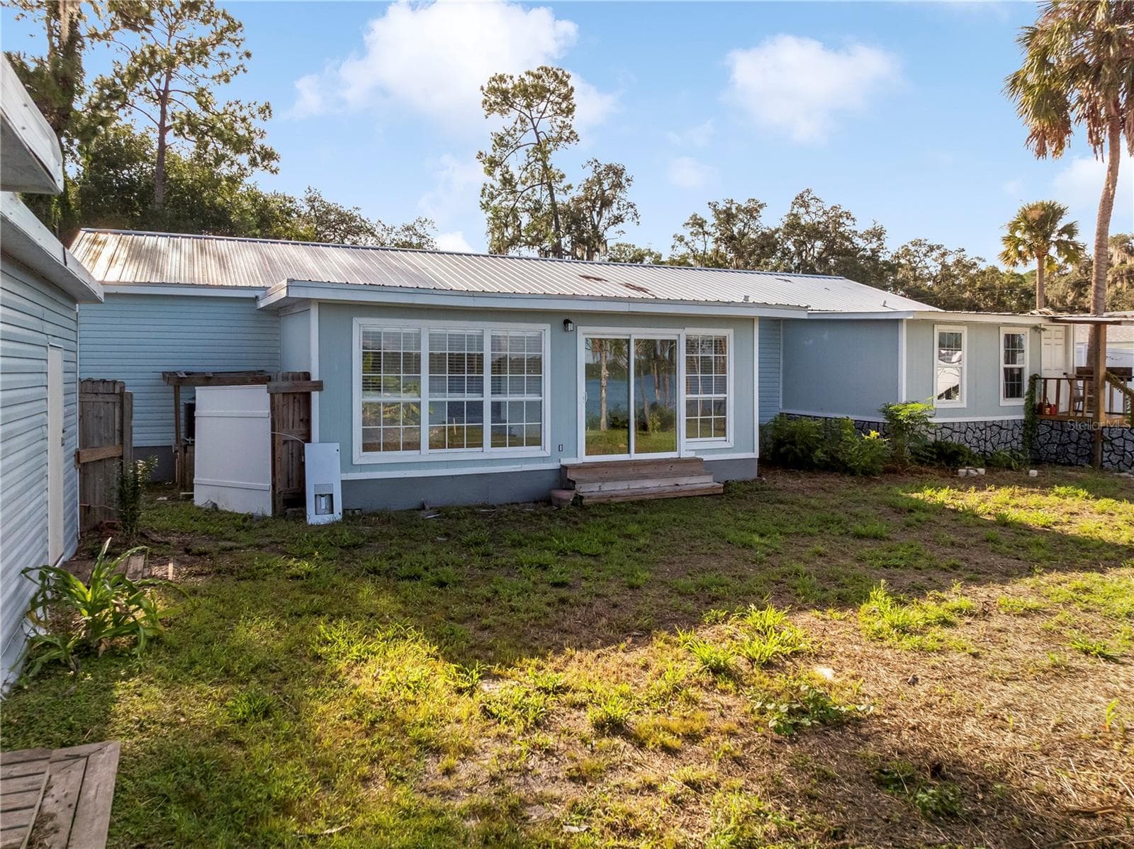 Rear exterior - 36112 LAKE UNITY RD, FRUITLAND PARK