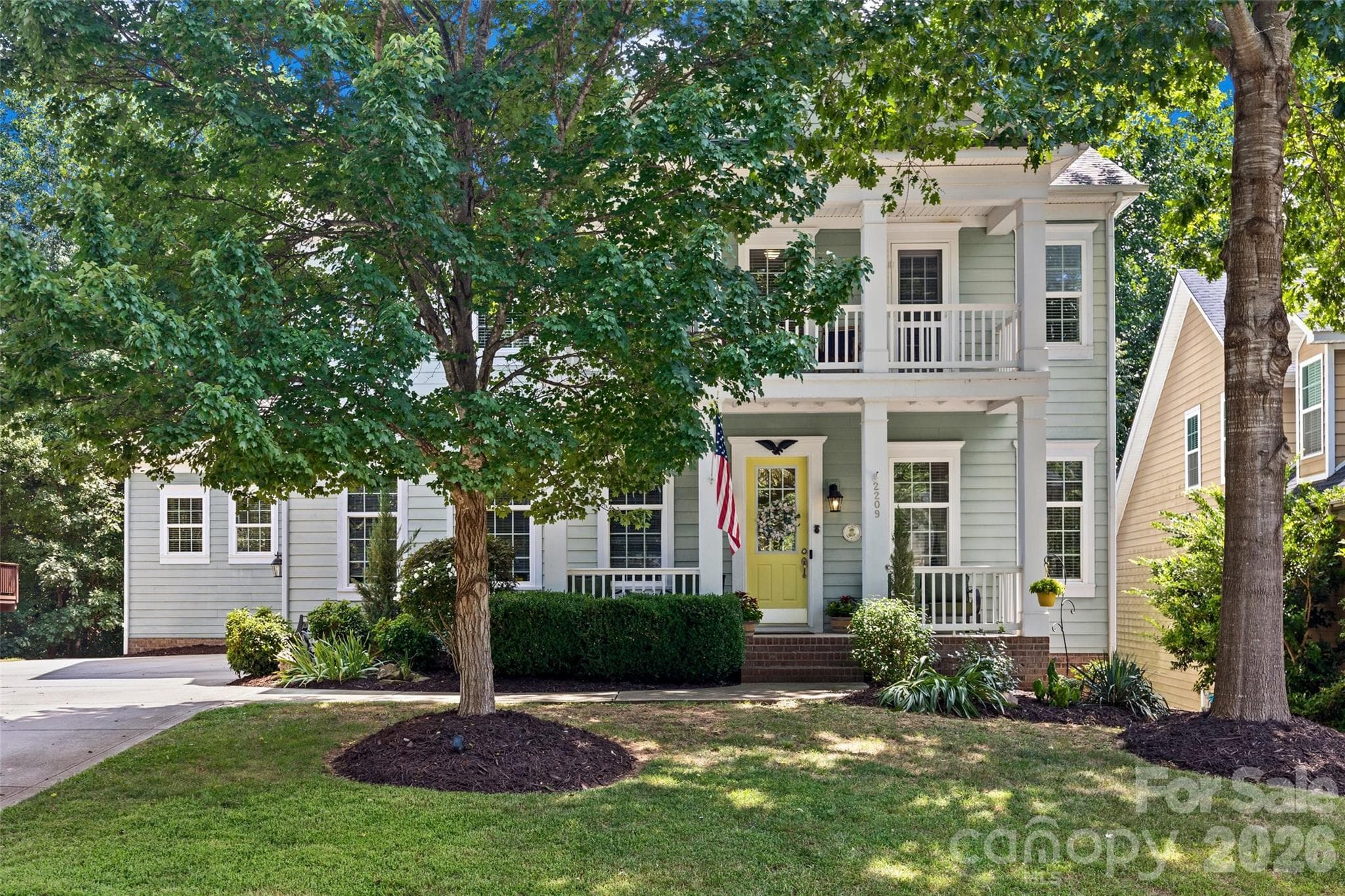 Curb appeal galore with front porch, balcony and mature trees - 2209 Trading Ford Drive, Waxhaw
