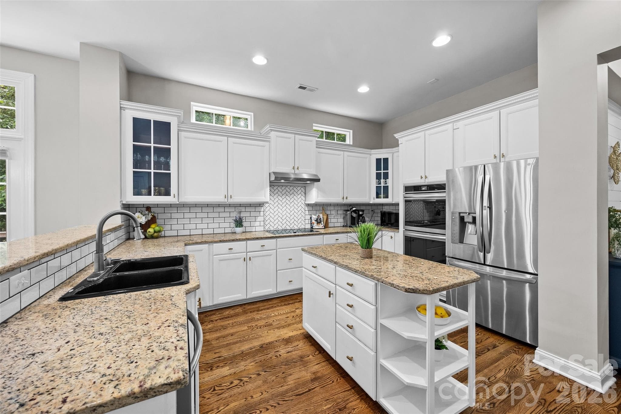 Spacious kitchen with. granite countertops, tile backsplash and SS appliances - 2209 Trading Ford Drive, Waxhaw