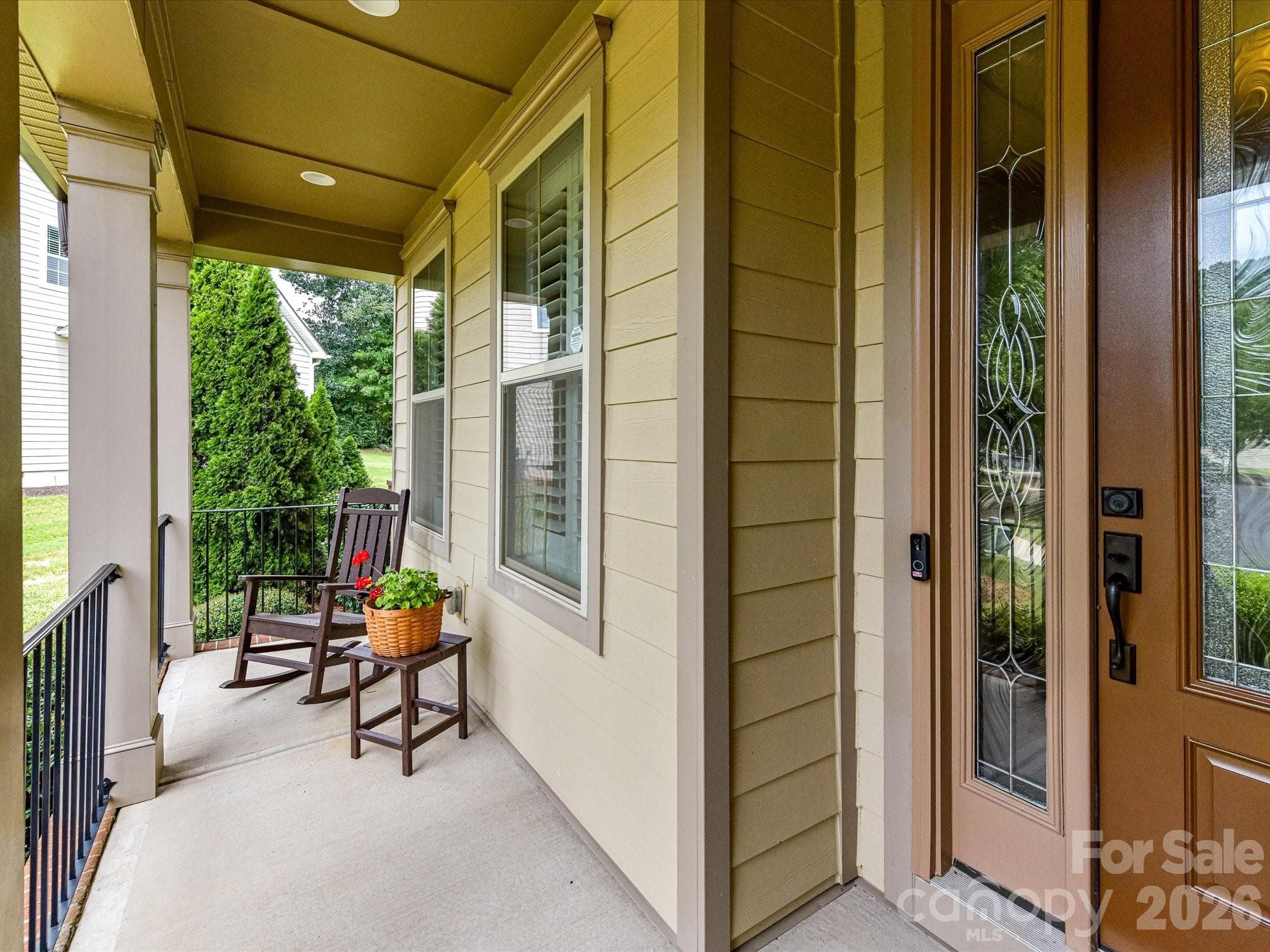 Charming covered front porch welcomes guests. - 12323 Cherrybark Lane, Charlotte