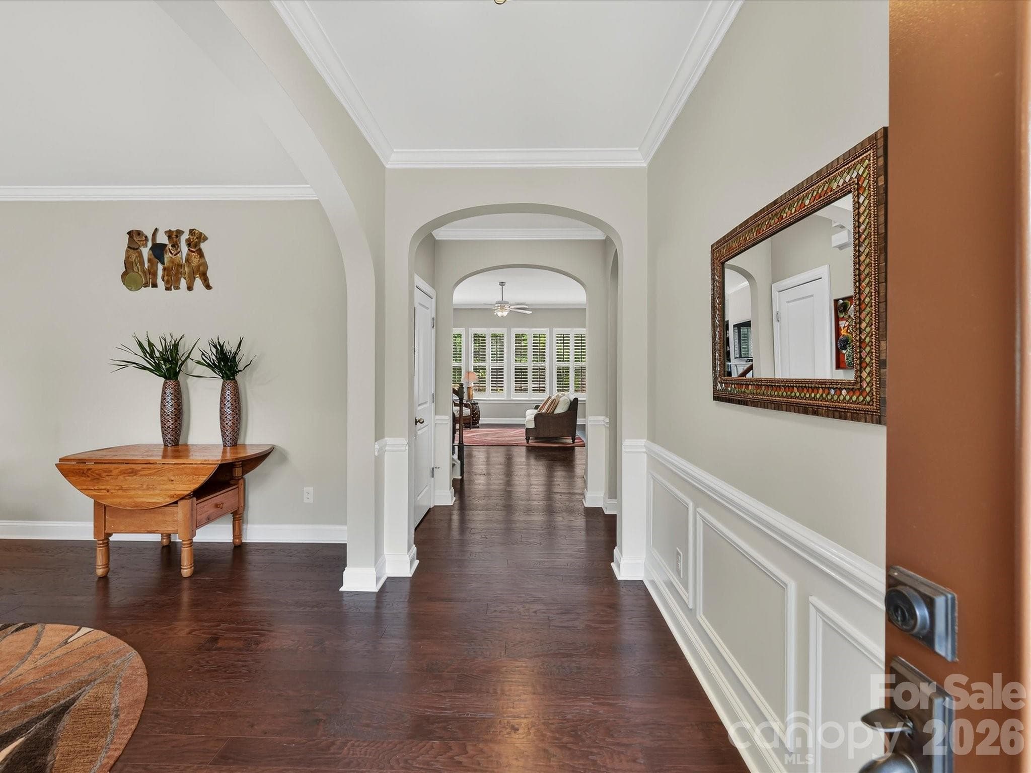 A beautiful foyer with wainscoting. - 12323 Cherrybark Lane, Charlotte