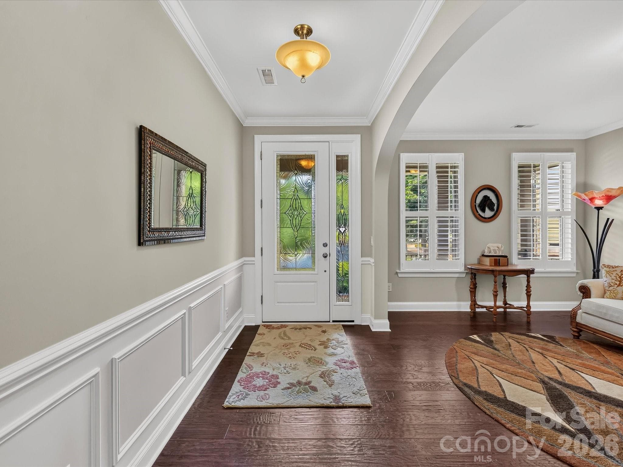 Grand arches add architectural interest in this stunning home. - 12323 Cherrybark Lane, Charlotte