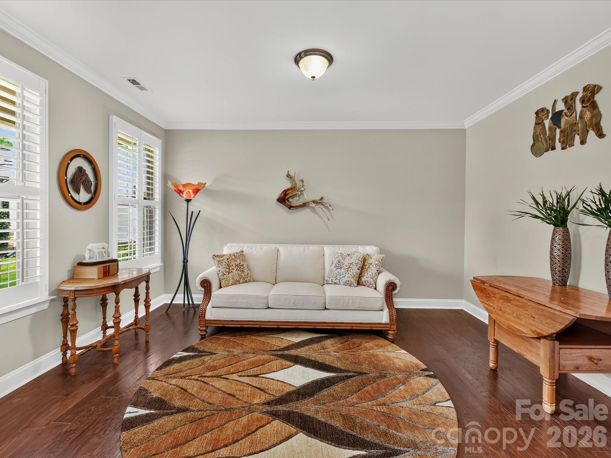A living room just off the foyer is a great space for entertaining or for a home office. - 12323 Cherrybark Lane, Charlotte