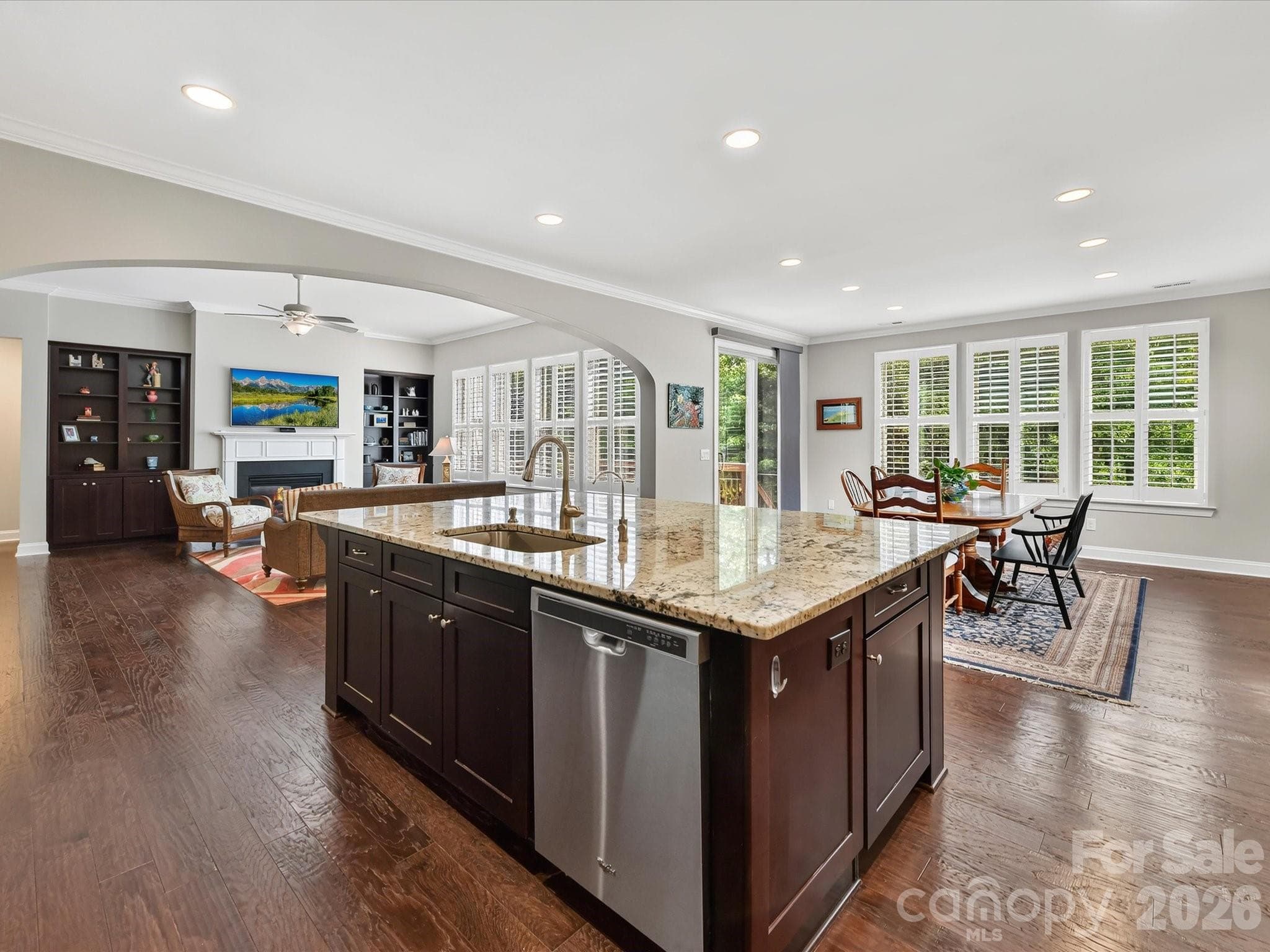 An open floorplan allows the cook to connect with those enjoying the family room. - 12323 Cherrybark Lane, Charlotte