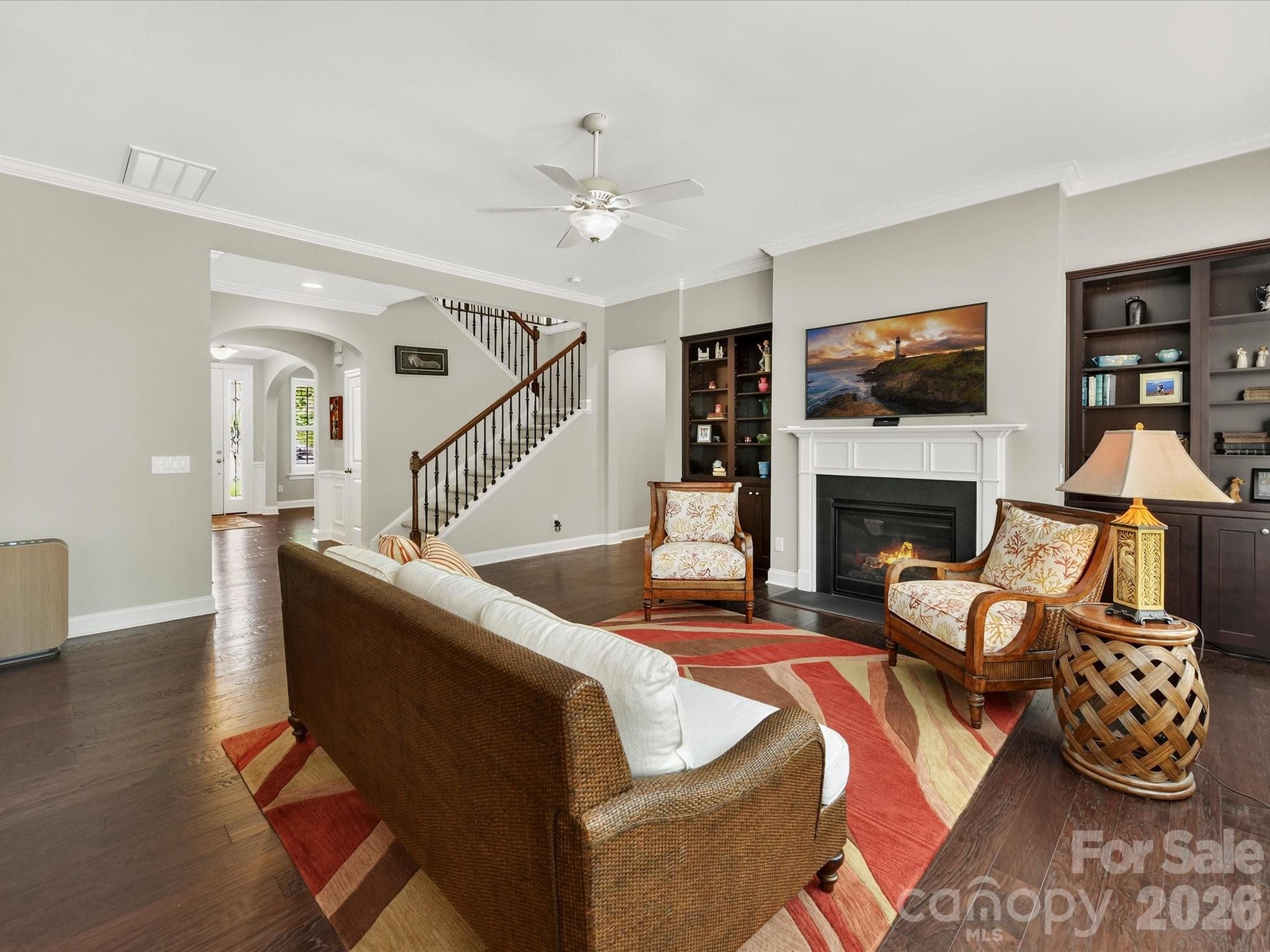 Built-ins and a gas log fireplace add charm to the large family room. - 12323 Cherrybark Lane, Charlotte