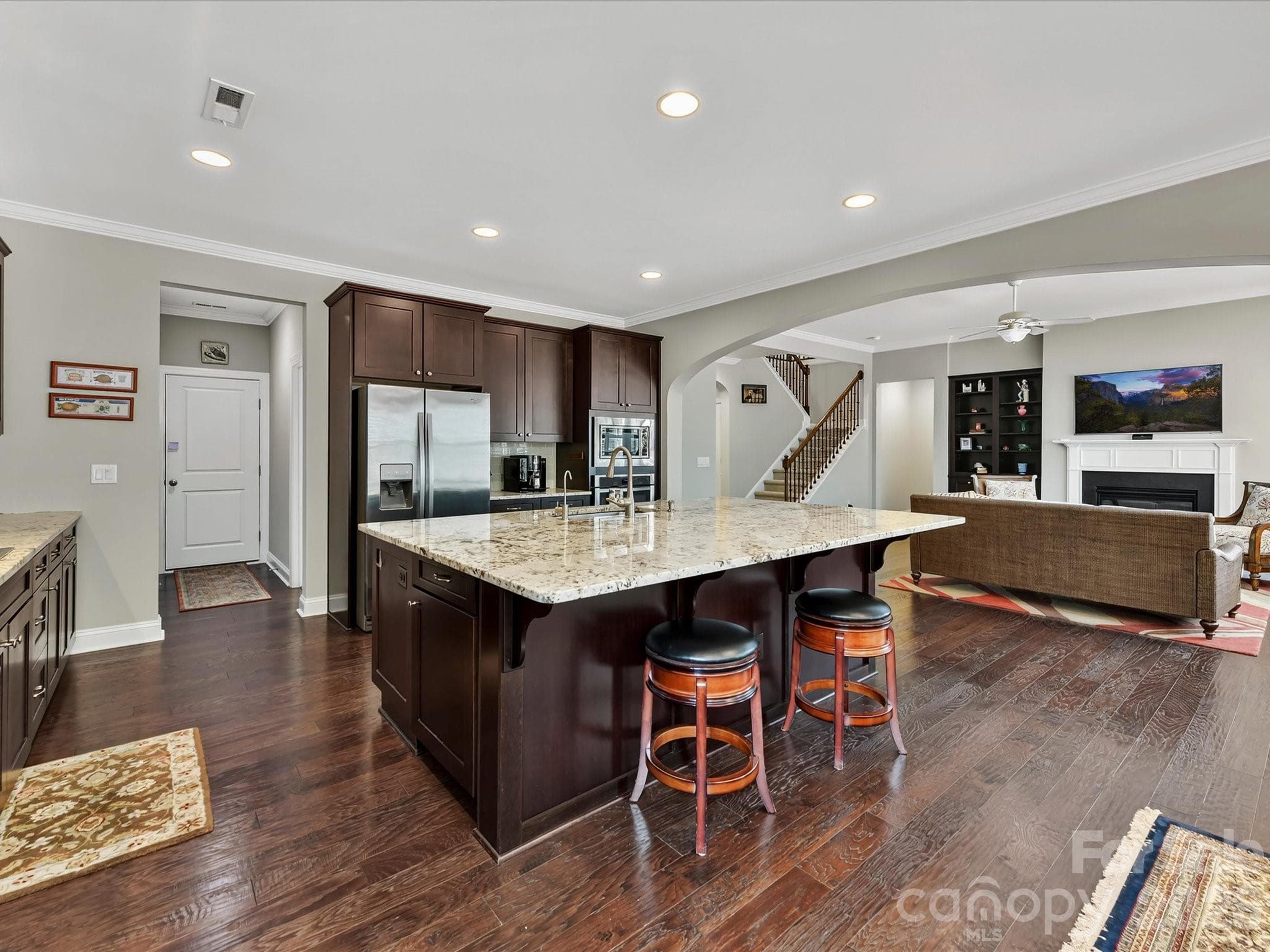 Plenty of breakfast bar seating on multiple sides. - 12323 Cherrybark Lane, Charlotte