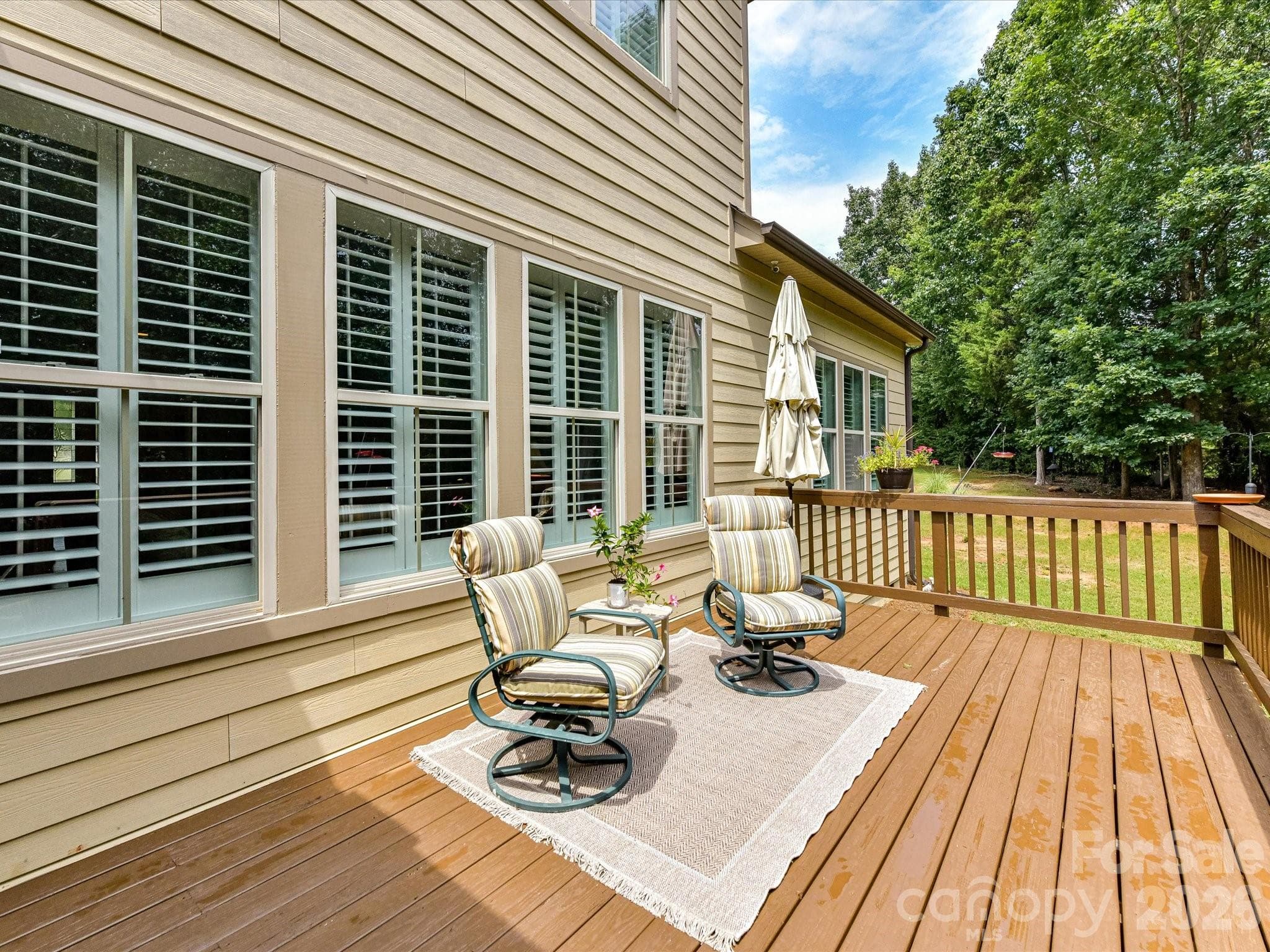 The deck overlooking the private backyard is a fun place to entertain. - 12323 Cherrybark Lane, Charlotte
