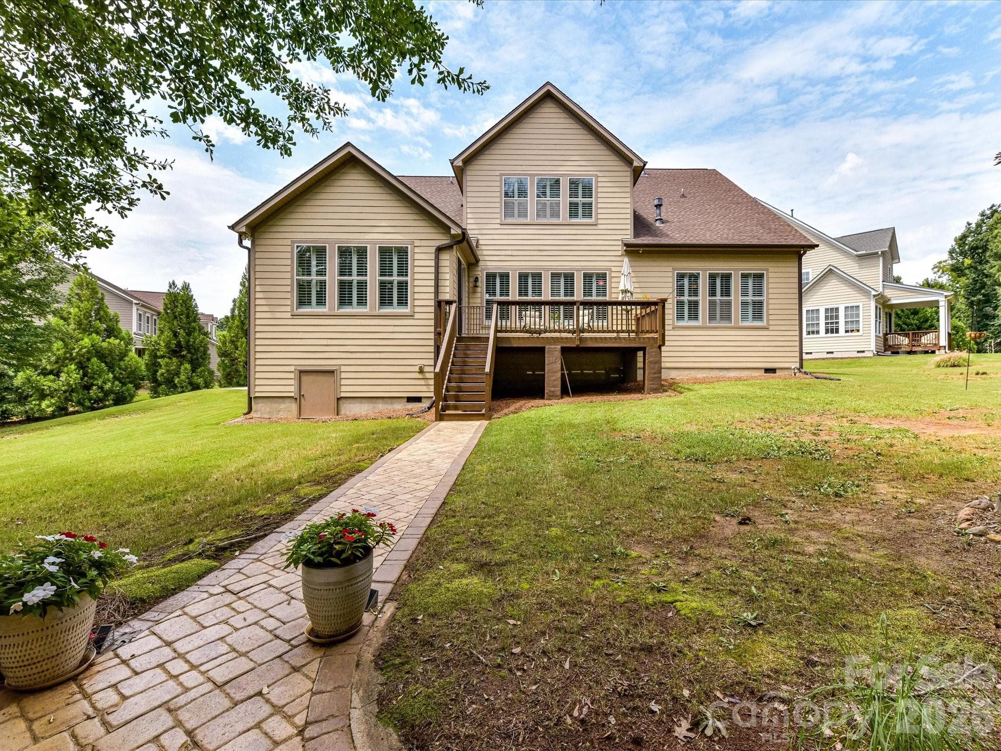 Such a pretty paver path from the fireplace to the deck stairs. - 12323 Cherrybark Lane, Charlotte