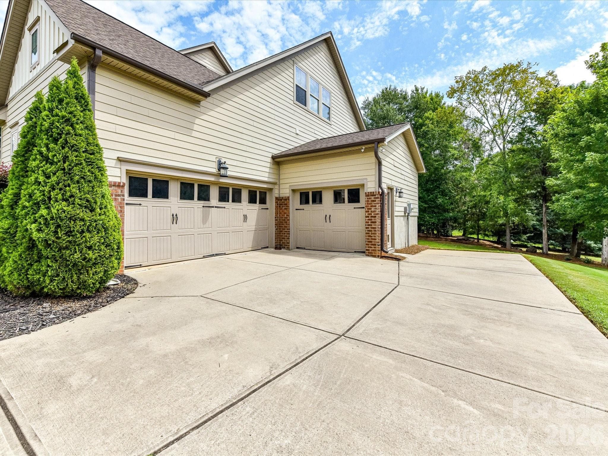Look at all the parking space & storage space between the parking pad & the 3-car garage! - 12323 Cherrybark Lane, Charlotte