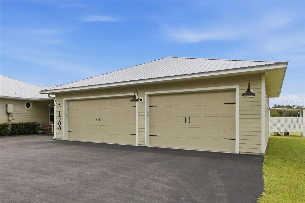 View of Garage & Drive Way - 1500 SPRING GARDEN RANCH RD, DE LEON SPRINGS