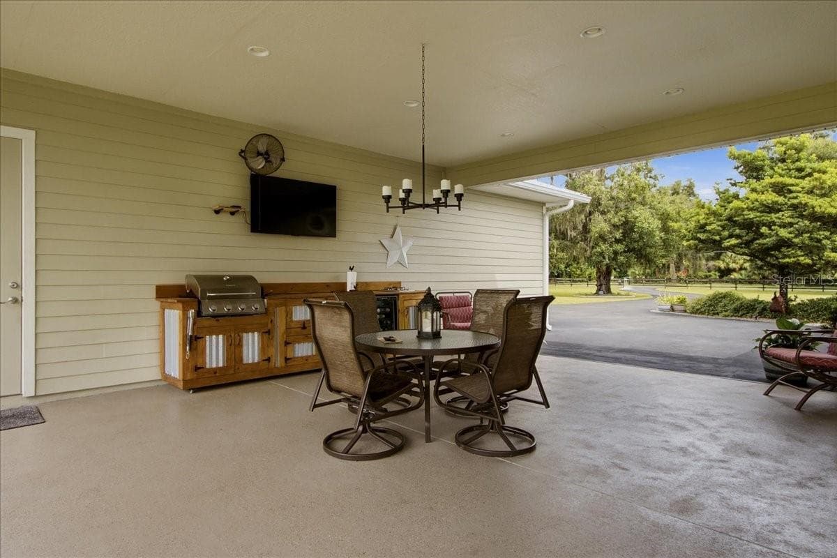 Breezeway complete with Chandelier, Tv & Fan - 1500 SPRING GARDEN RANCH RD, DE LEON SPRINGS