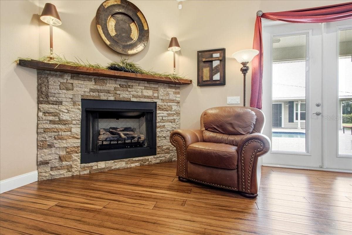 Stone  gas Fire Place with Solid Wood Mantel - 1500 SPRING GARDEN RANCH RD, DE LEON SPRINGS