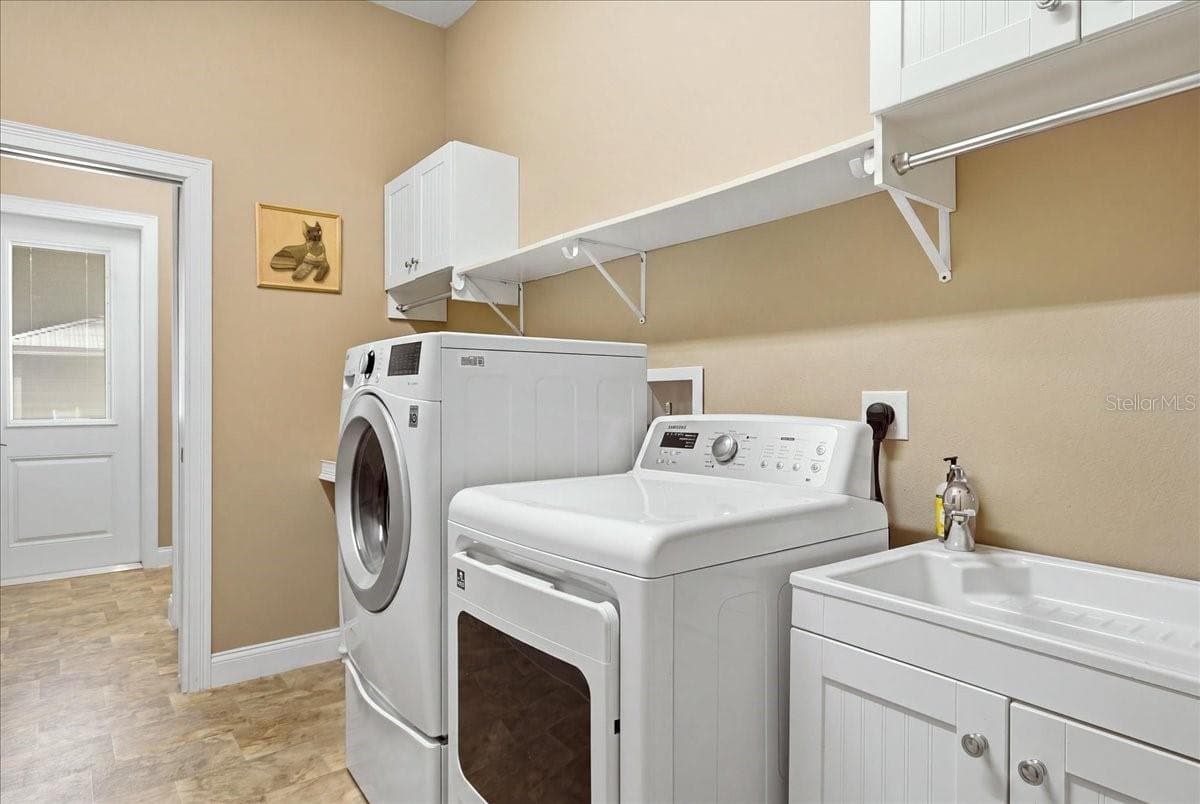Laundry Room with Sink & Cabinetry - 1500 SPRING GARDEN RANCH RD, DE LEON SPRINGS