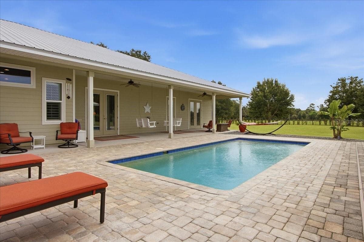 View of Pool and Main House - 1500 SPRING GARDEN RANCH RD, DE LEON SPRINGS