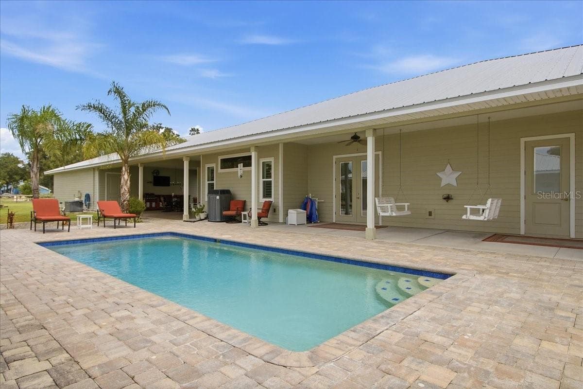View of Pool & Main House from Guest House - 1500 SPRING GARDEN RANCH RD, DE LEON SPRINGS