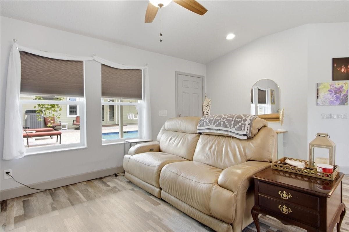 Guest House Living Room & View of Pool Area - 1500 SPRING GARDEN RANCH RD, DE LEON SPRINGS