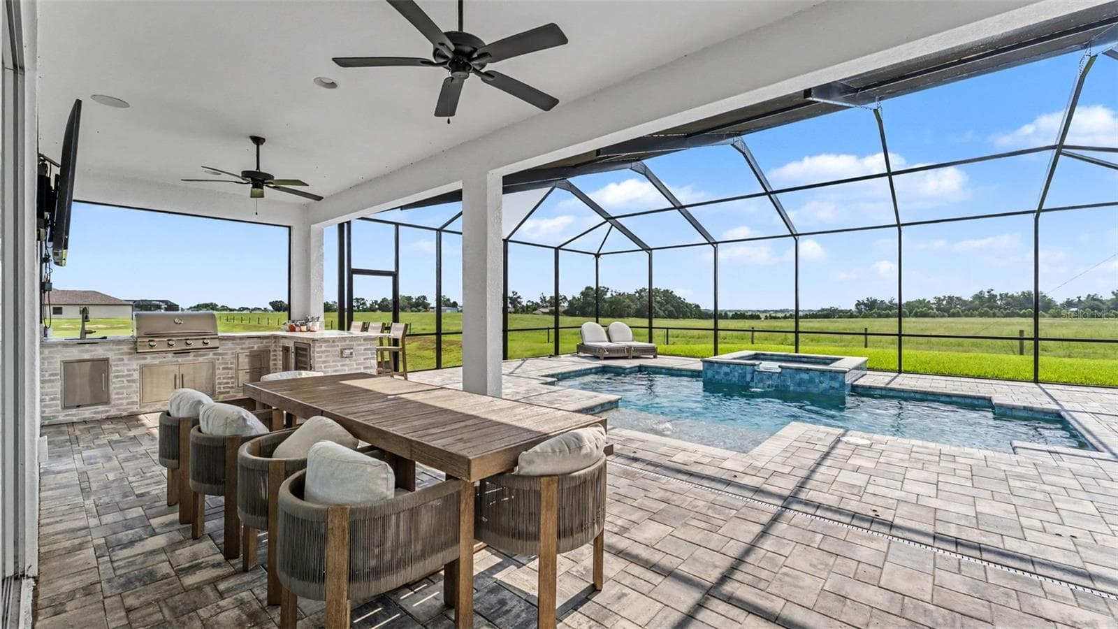 Rear Patio with Upgraded Outdoor Kitchen - 7034 BENTRIDGE DR, LAKELAND
