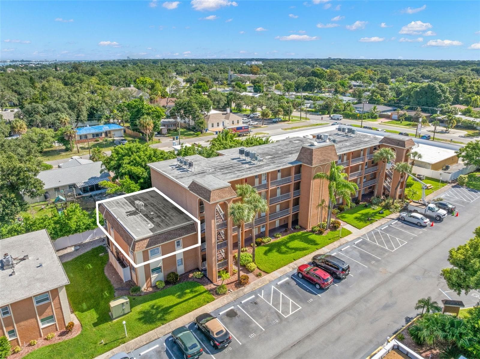 Set among mature trees and palms, this 2-bedroom, 1-bath condo at New Atlantis Club offers a comfortable 980-square-foot layout, convenient surface parking and a well-kept residential setting in Largo. - 12760 INDIAN ROCKS RD #107, LARGO