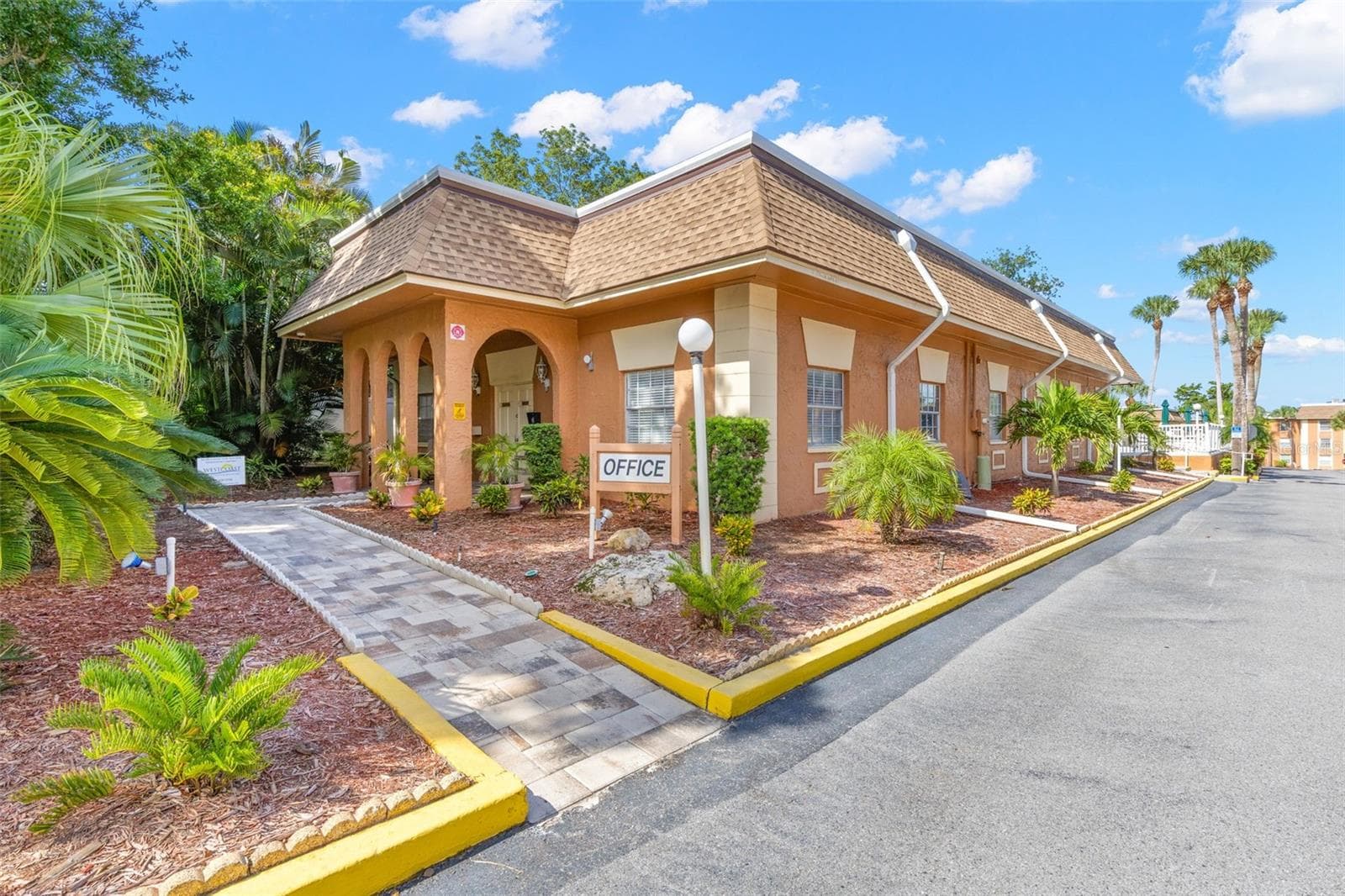 Within the community, the on-site office is surrounded by tropical landscaping and a paved walkway, adding another convenient touch to the New Atlantis Club setting. - 12760 INDIAN ROCKS RD #107, LARGO