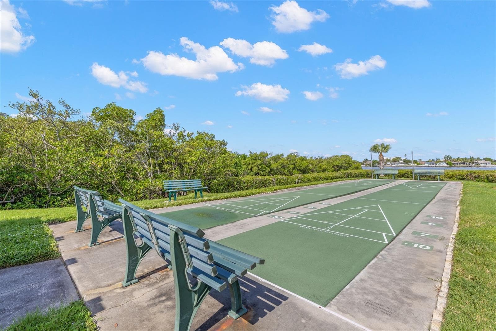Shuffleboard courts add another outdoor amenity, set against a backdrop of mangroves and a water view that gives this part of the community a distinctly coastal feel. - 12760 INDIAN ROCKS RD #107, LARGO