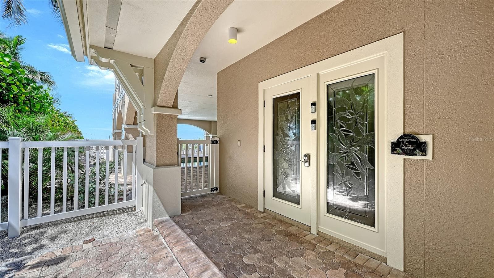 Front door entrance to building. Note: 2 low steps into building foyer could accommodate wheelchair access to elevator. Garage also has 1 low step into the foyer. - 106 74TH ST #100, HOLMES BEACH