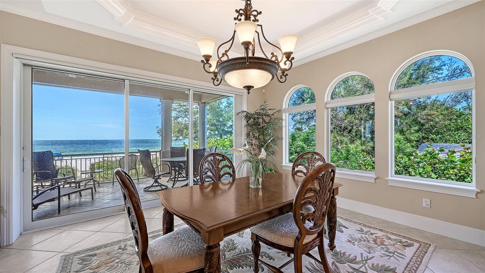 Formal dining area can accommodate a larger table and chairs comfortably. - 106 74TH ST #100, HOLMES BEACH