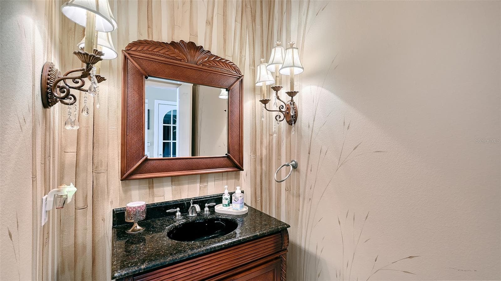 Half bath between kitchen and bedrooms is also convenient to the elevator. - 106 74TH ST #100, HOLMES BEACH