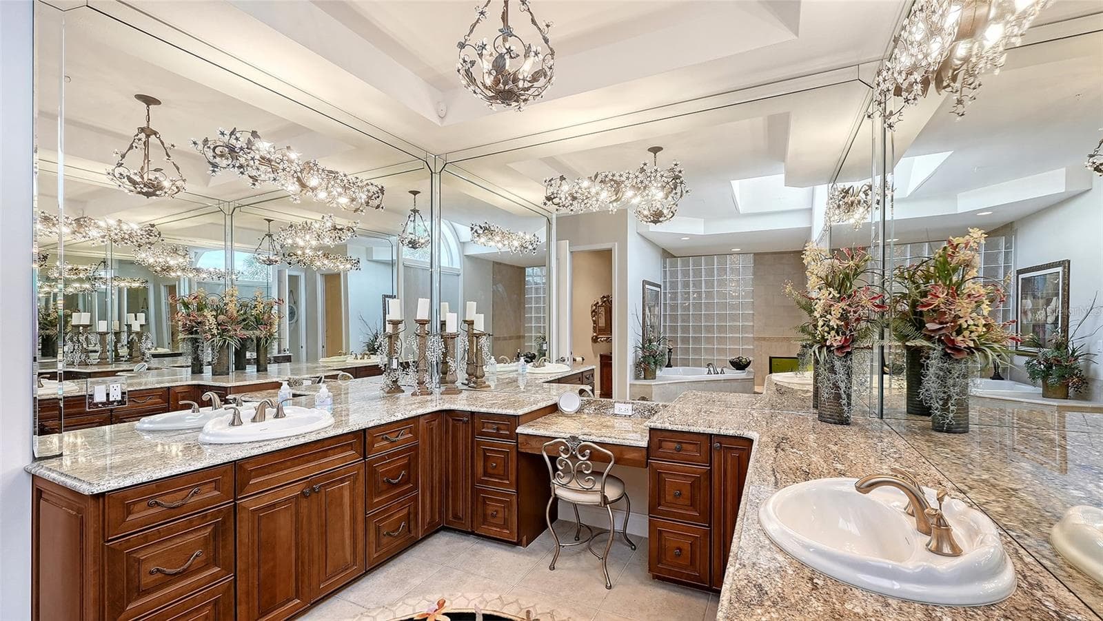The generously proportioned primary bath offers a refined, classic aesthetic with beautiful scale and an abundance of natural light. - 106 74TH ST #100, HOLMES BEACH