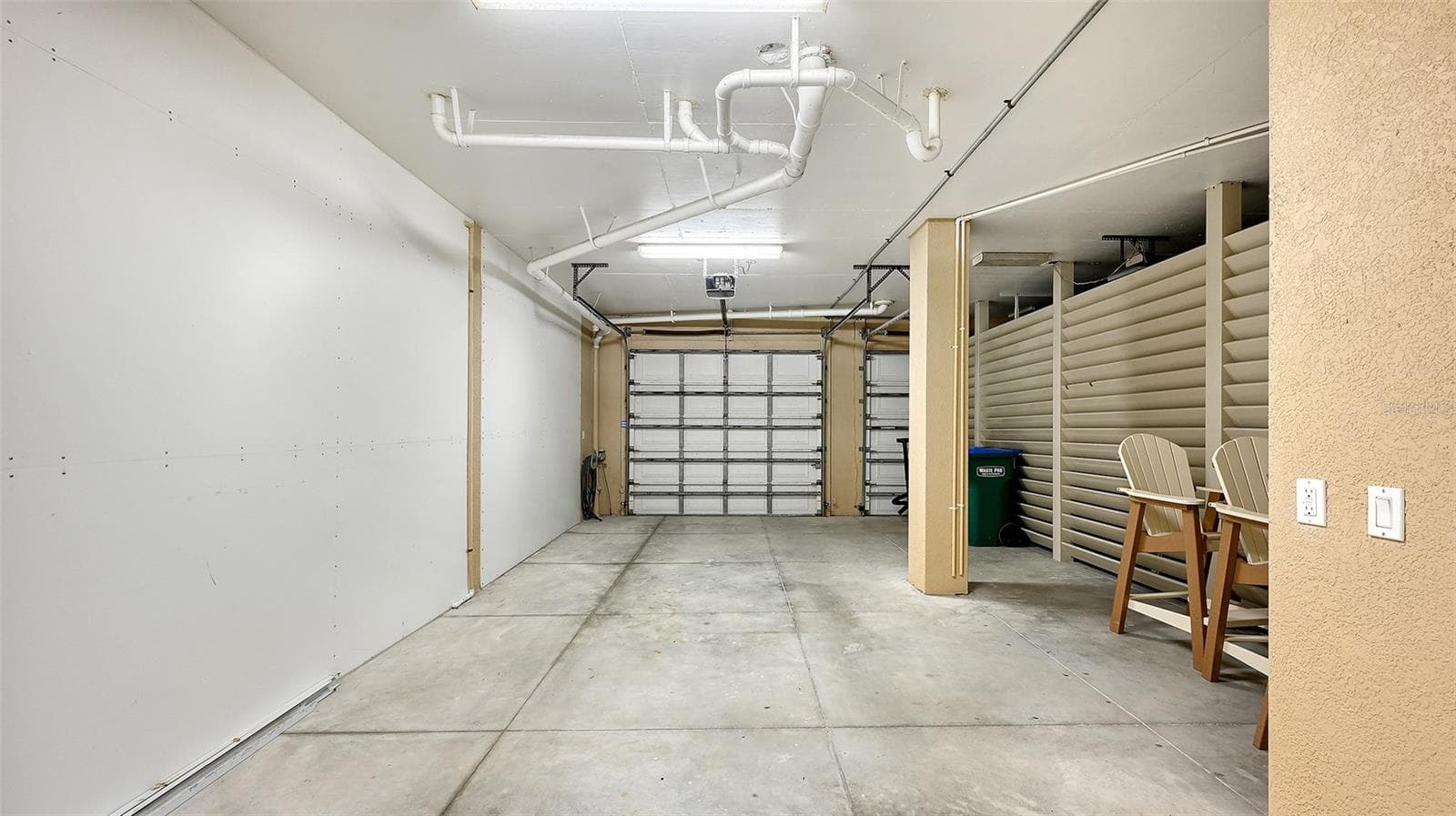 private tandem garage with storage space for bikes, scooters,beach toys, golf cart - 106 74TH ST #100, HOLMES BEACH