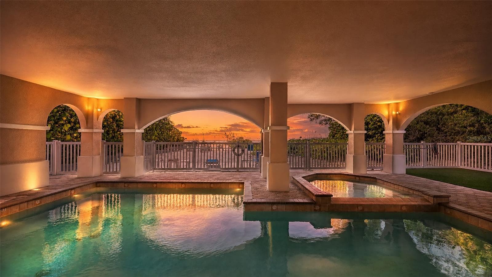 Virtual sunset over pool and spa. Imagine seeing this every night...make it yours - 106 74TH ST #100, HOLMES BEACH