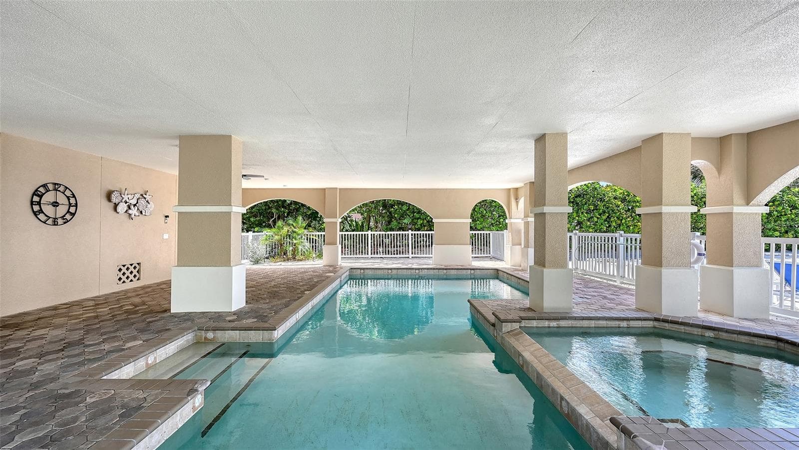 Daytime picture of heated pool and spa - 106 74TH ST #100, HOLMES BEACH