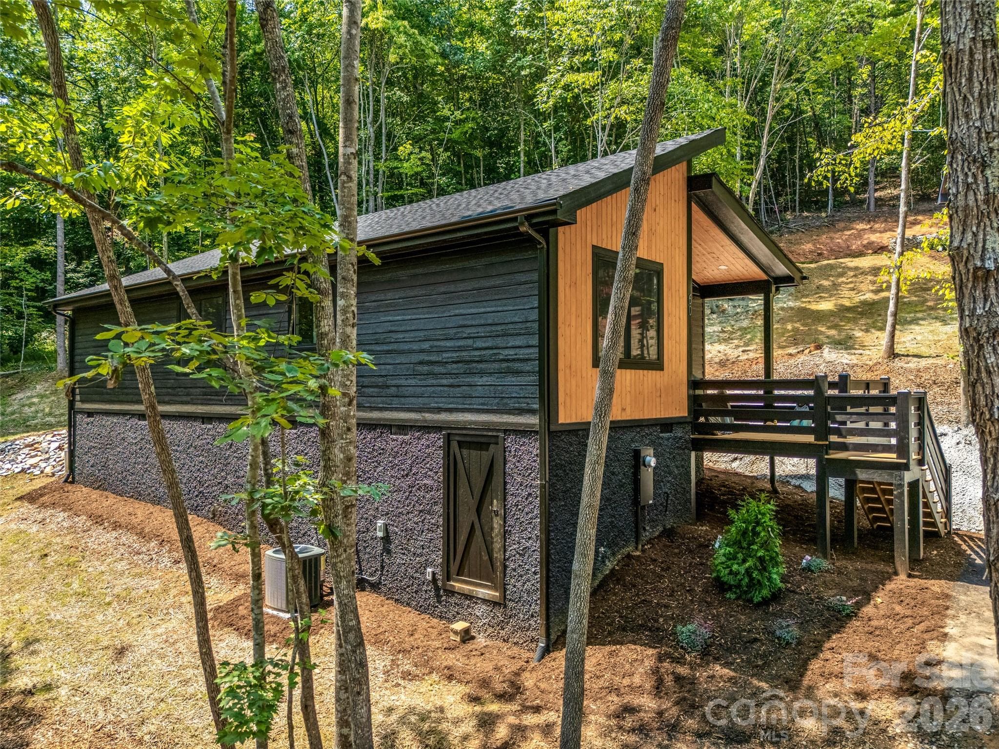 Side exterior nestled in the trees - 60 Catatoga Trail, Marion