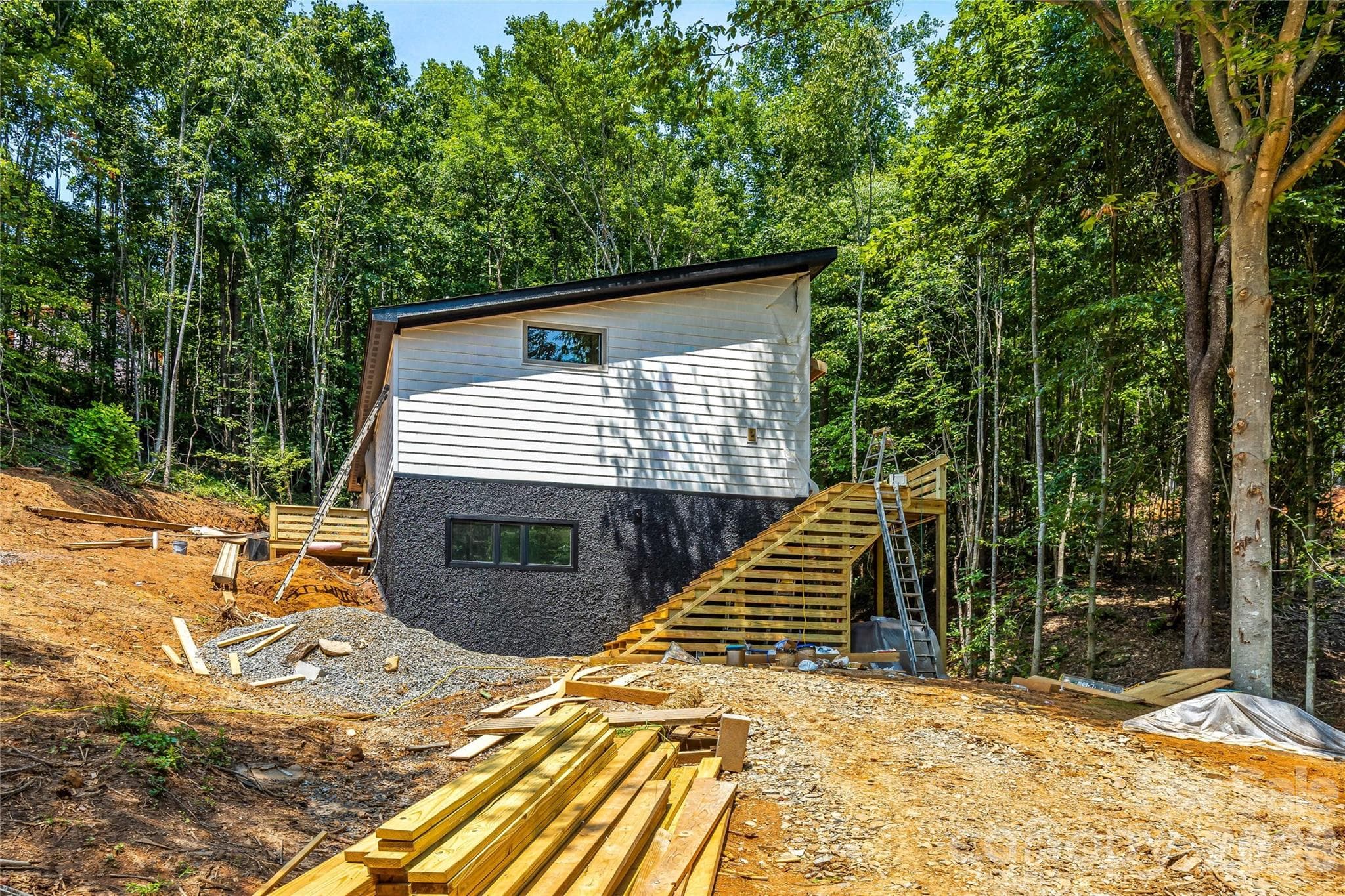 Home nestled among the trees by stream - 119 Catatoga Trail, Marion