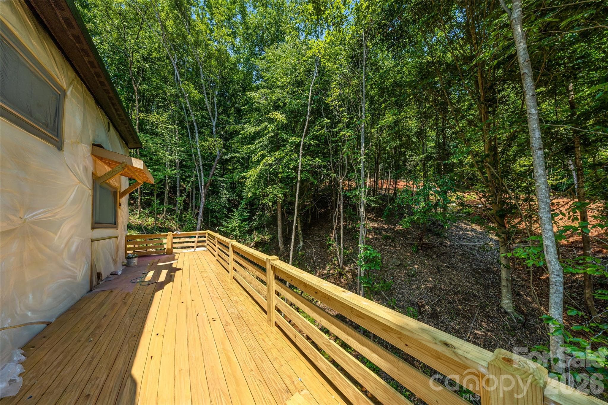 Expansive deck overlooking wooded setting - 119 Catatoga Trail, Marion