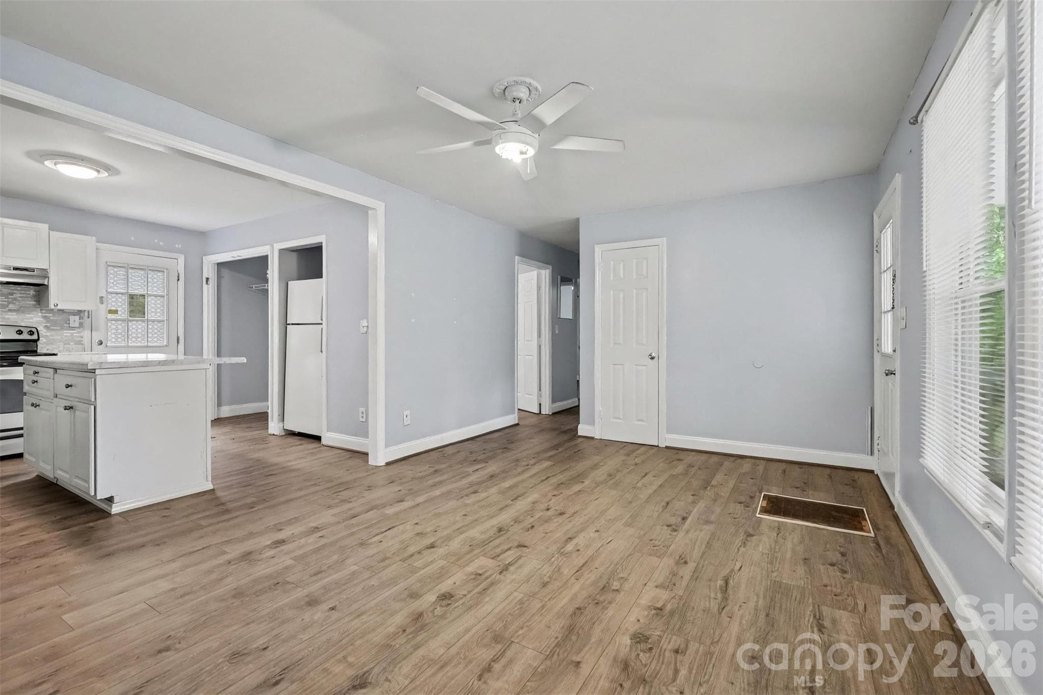 Living room and kitchen flow together - 802 Stowe Drive, Lowell