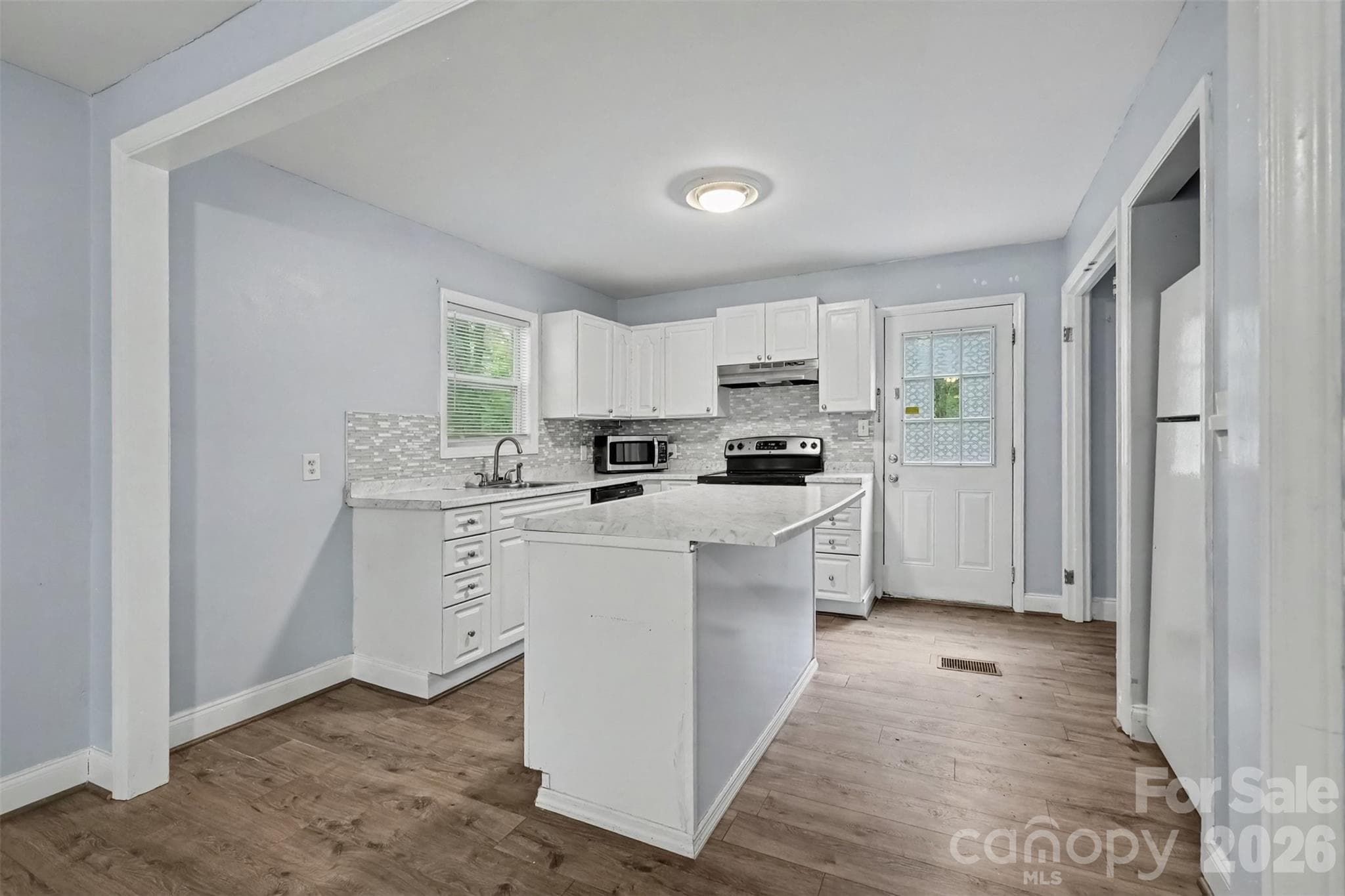Kitchen with island - 802 Stowe Drive, Lowell