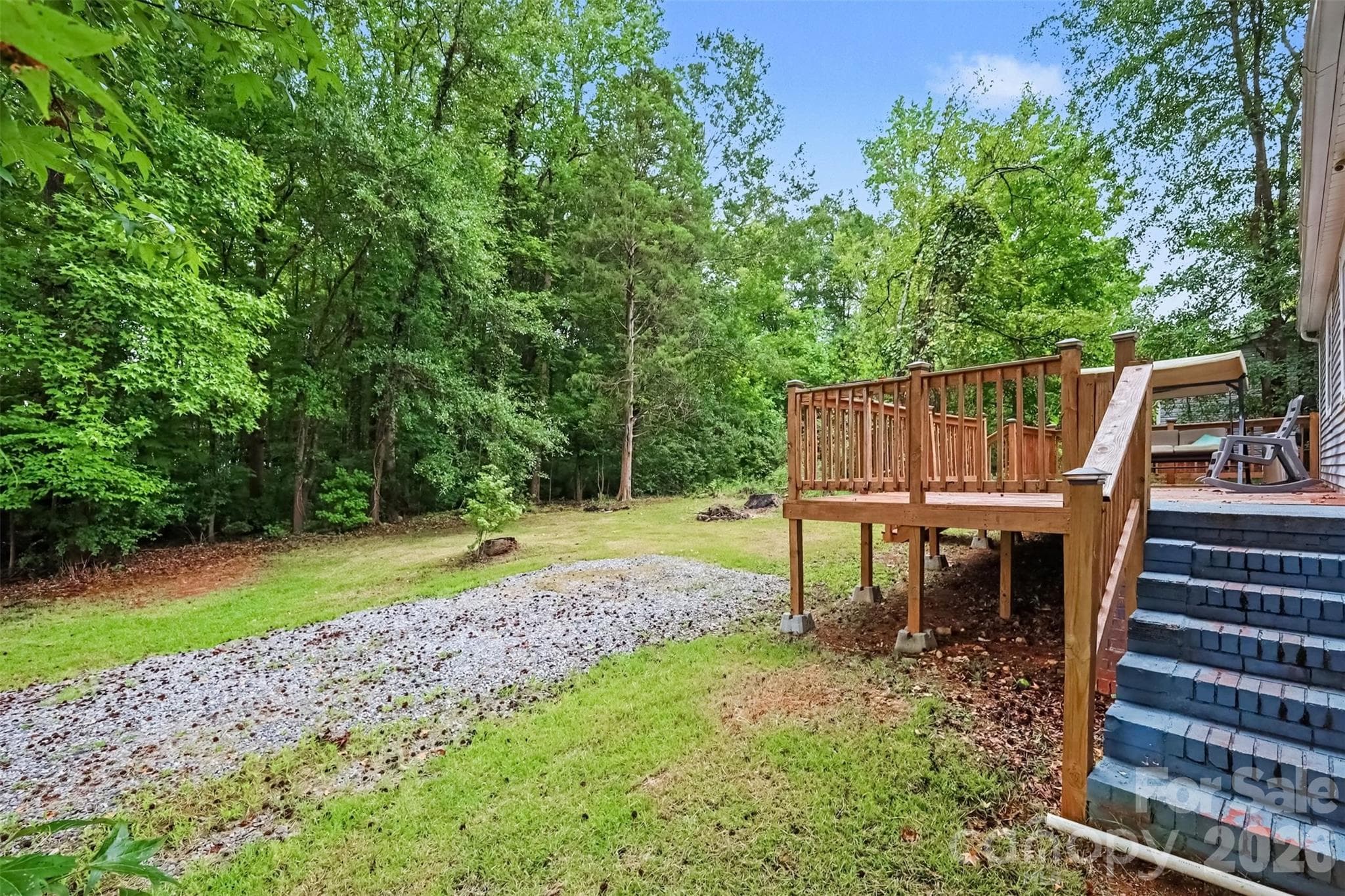 Back deck and gravel drive - 802 Stowe Drive, Lowell