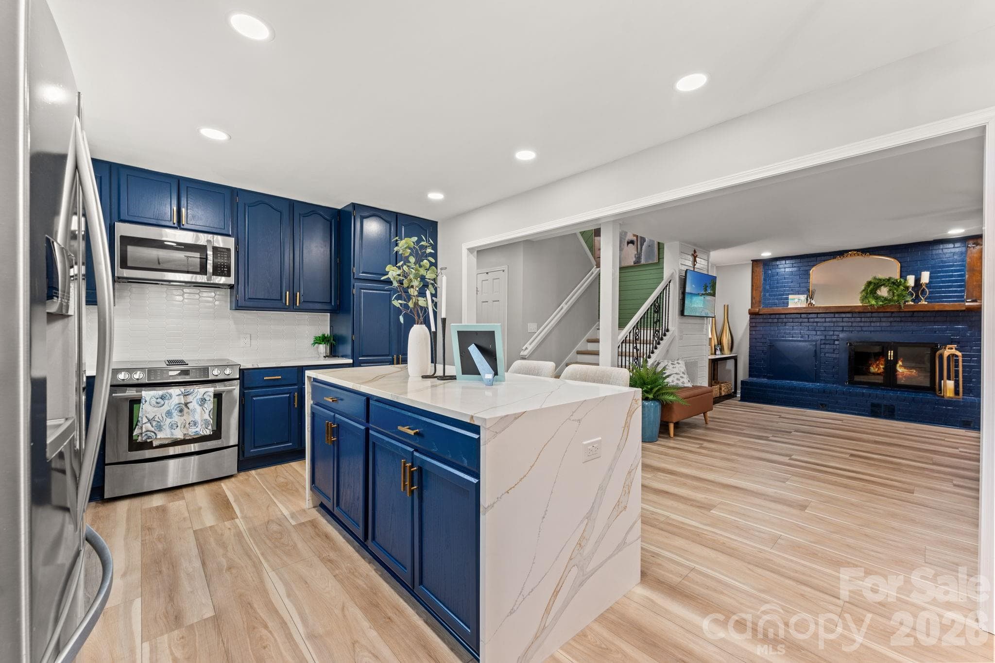 High End Chefs Kitchen with High-End Waterfall Quartz Countertops - 1314 Holly Drive, North Myrtle Beach