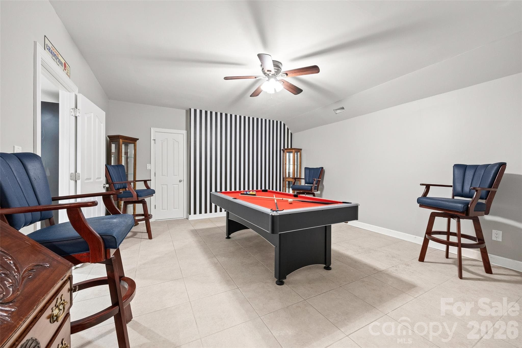 This room has had many fun nights. The pool table has a ping pong table that fits right on top. 4 billiard chairs to complete the look - 771 Cherry Hills Place, Rock Hill