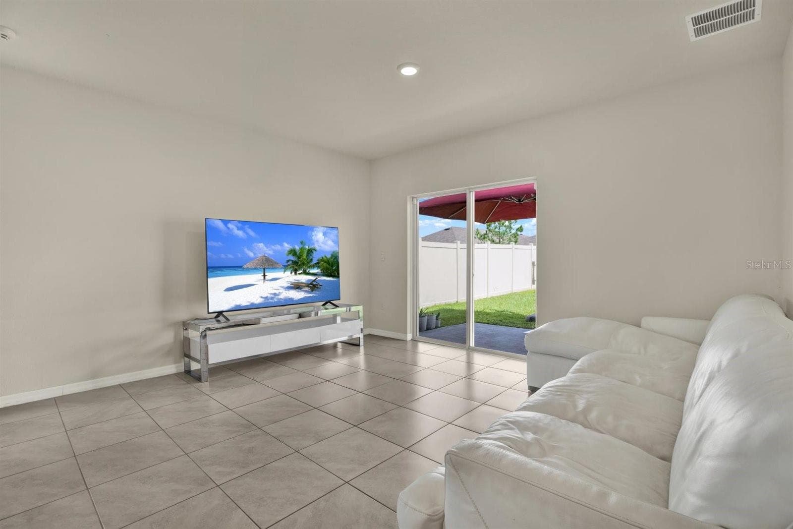 Sliding glass door straight out to the private patio - 34047 JASPER STONE DR, WESLEY CHAPEL